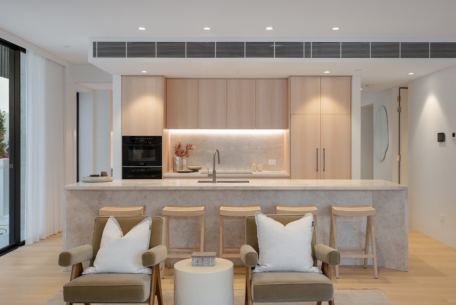 Premium kitchen with Raven limestone island and Miele appliances